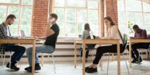 Coworking space with diverse people working in a shared office.